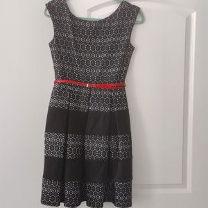 Black and white dress never worn. red Patent belt. Also comes with black patent